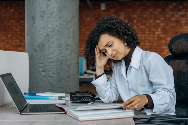Woman dealing with inheritance property tax UK paperwork after receiving inherited home